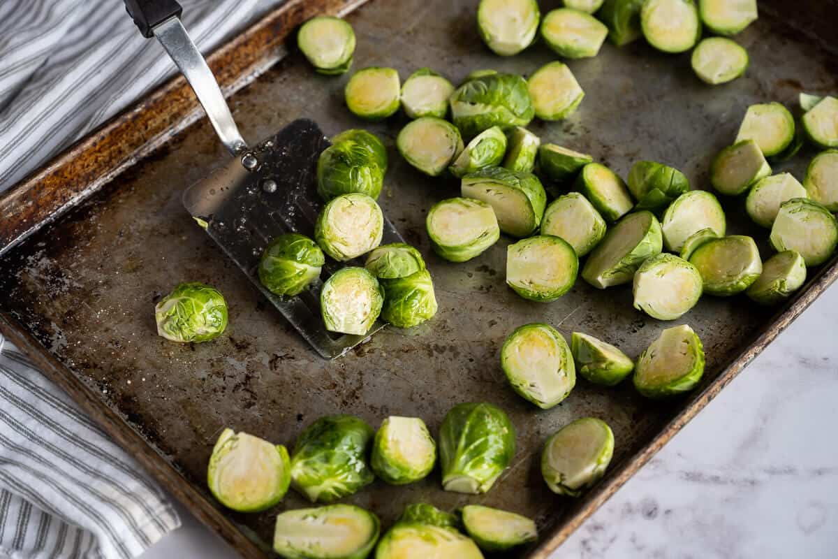 spatula tossing seasoned brussels sprouts