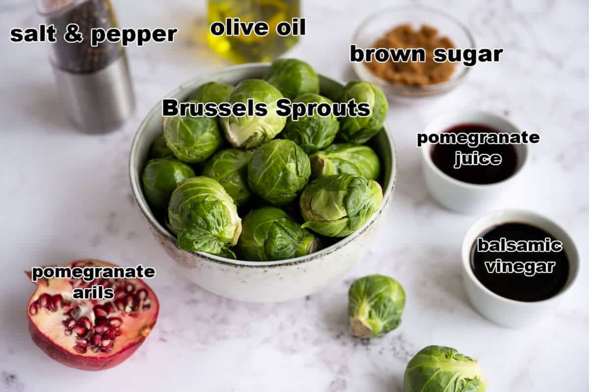 Ingredients for roasted brussels sprouts with pomegranate balsamic reduction: Brussels, olive oil, salt, pepper, brown sugar, pomegranate juice, balsamic vinegar.