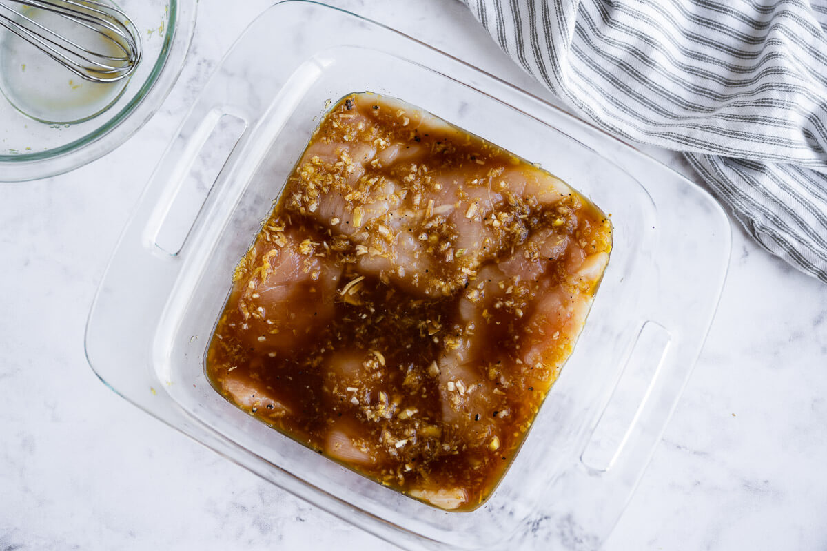 raw chicken breasts marinating in homemade teriyaki sauce