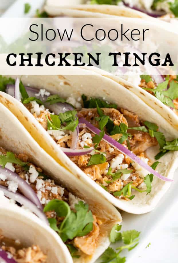 Chicken Tinga makes the most delicious shredded chicken tacos! Flavorful, tender, juicy and smoky! Cooking them is a breeze in your slow cooker. Also works perfectly for Enchiladas, Burritos, Tostadas, Nachos, and all your favorite Mexican Inspired dishes! #chickentinga #slowcooker #crockpot via @artfrommytable
