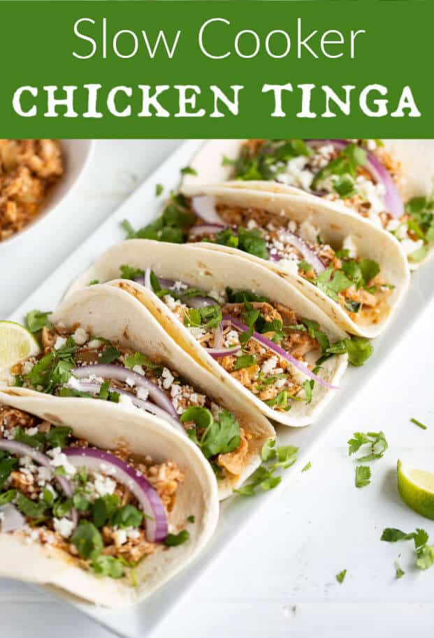 Chicken Tinga makes the most delicious shredded chicken tacos! Flavorful, tender, juicy and smoky! Cooking them is a breeze in your slow cooker. Also works perfectly for Enchiladas, Burritos, Tostadas, Nachos, and all your favorite Mexican Inspired dishes! #chickentinga #slowcooker #crockpot via @artfrommytable