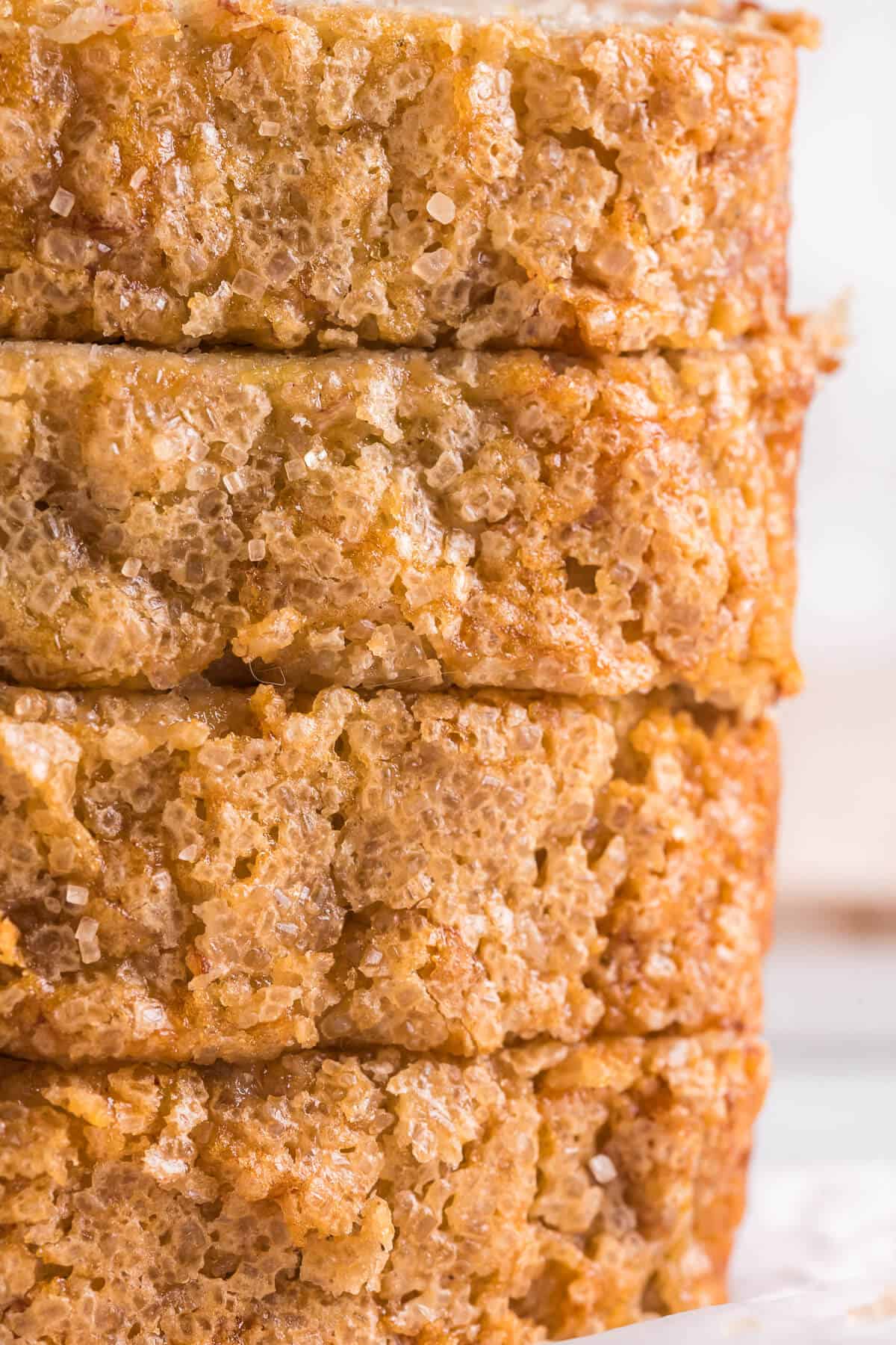 Close up of lined up slices of eggless banana bread.