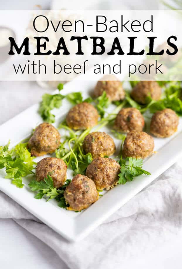 Italian meatballs on a platter garnished with fresh parsley via @artfrommytable