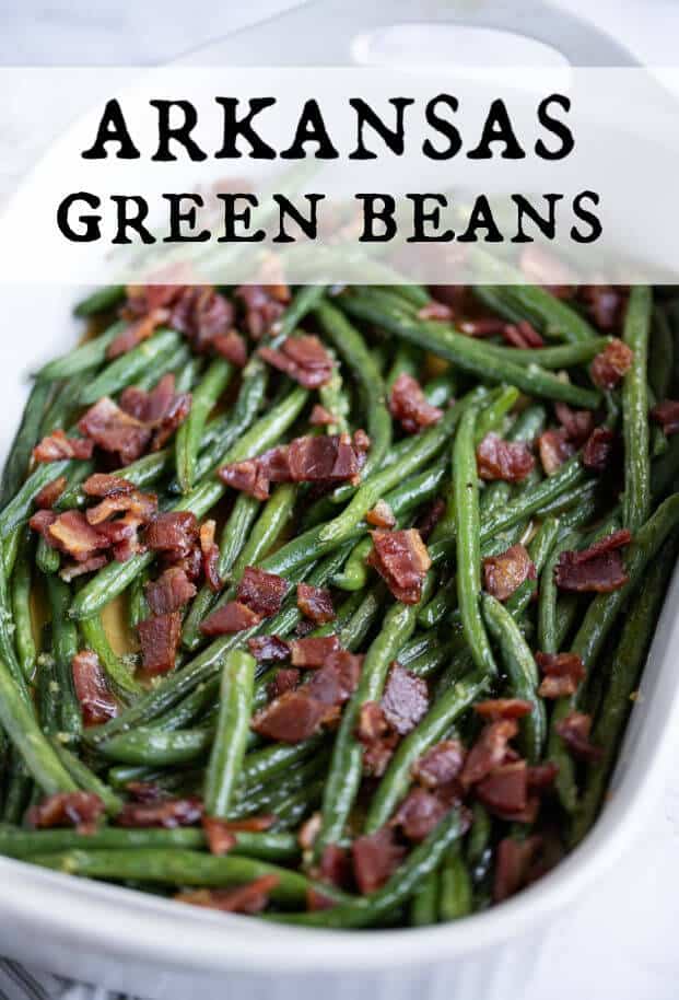 Fresh green beans combined with a tangy garlic-butter sauce and topped with crisp bacon makes this Arkansas Green Beans recipe an unforgettable side dish! via @artfrommytable