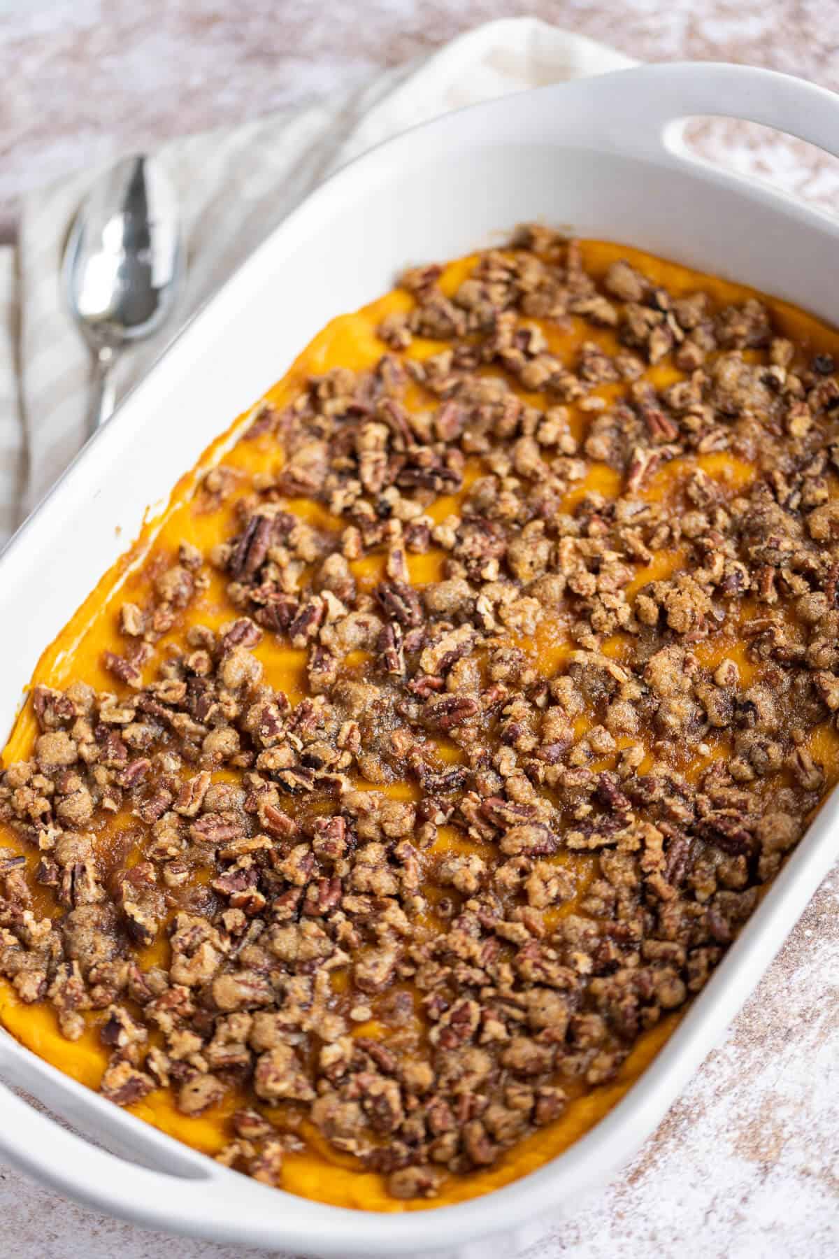 Sweet Potato Crunch in a white casserole dish.