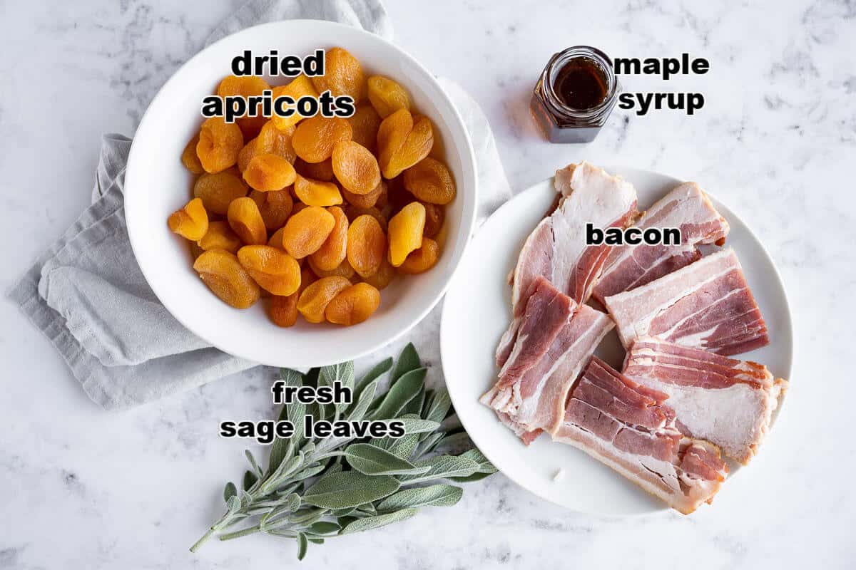 Ingredients for bacon wrapped apricots: dried apricots, bacon, sage leaves, and maple syrup.
