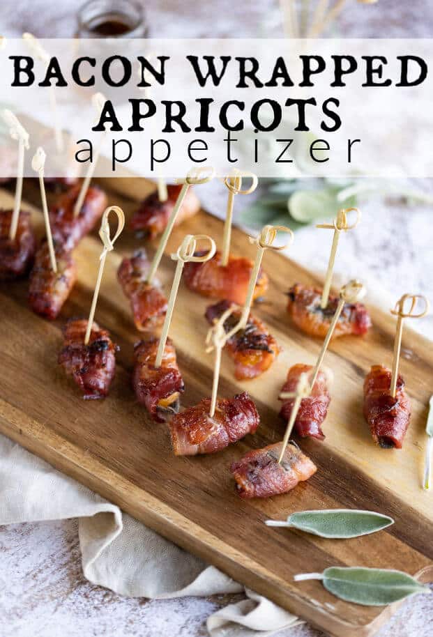 Bacon wrapped apricots on a wooden serving board. via @artfrommytable