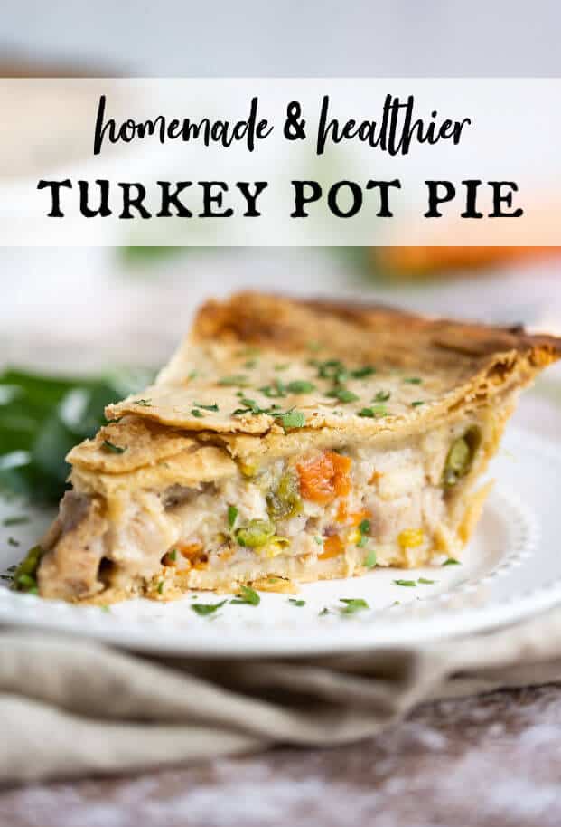 Slice of homemade turkey pot pie on a white plate garnished with fresh chopped parsley via @artfrommytable