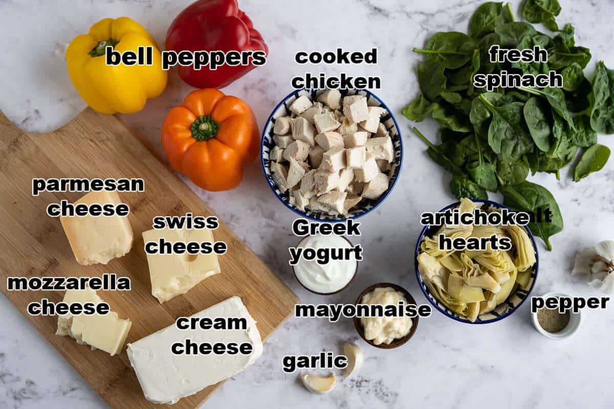 ingredients to make chicken, spinach, and artichoke stuffed peppers.