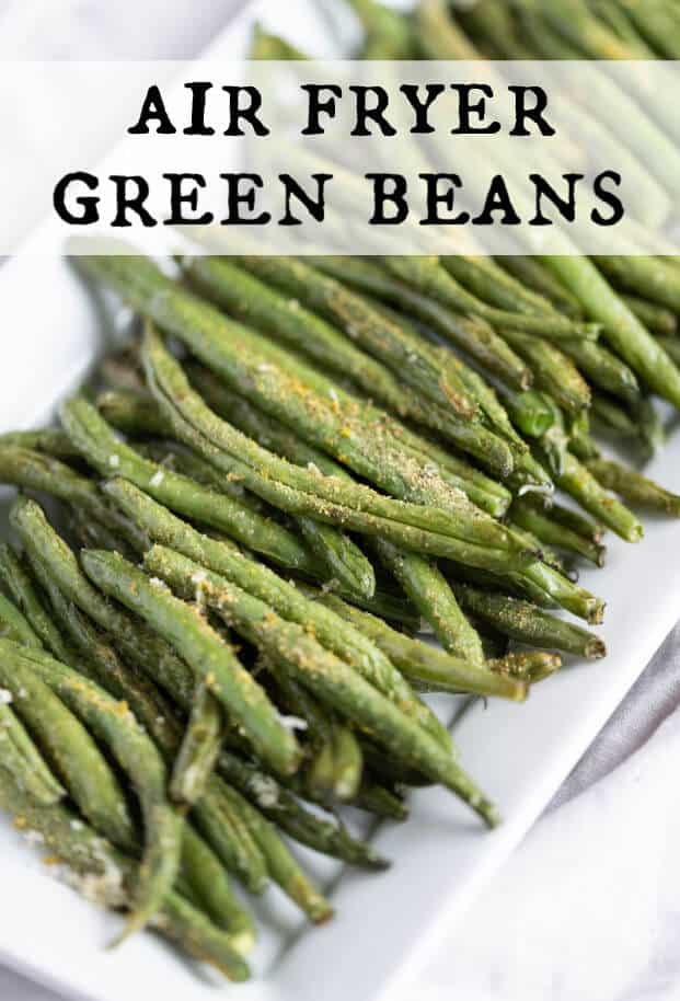Air fried green beans with seasonings on a rectangle white platter. via @artfrommytable