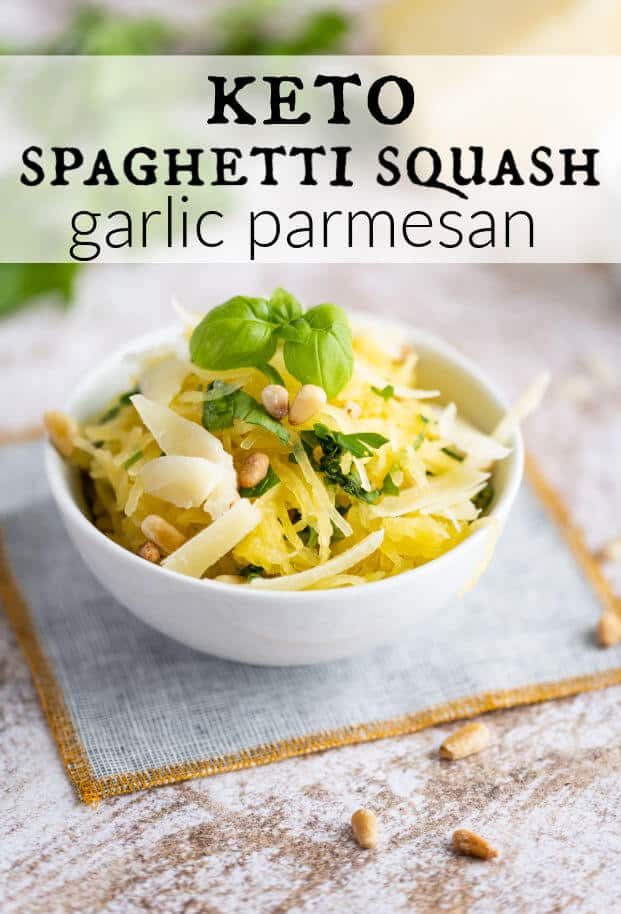 Cooked spaghetti squash in a white bowl with garlic, parmesan and fresh herbs. via @artfrommytable