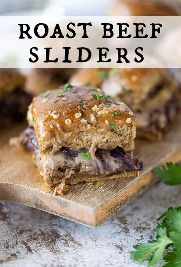 Baked sliders stuffed with roast beef, cheese, and caramelized onions, topped with fresh parsley. via @artfrommytable