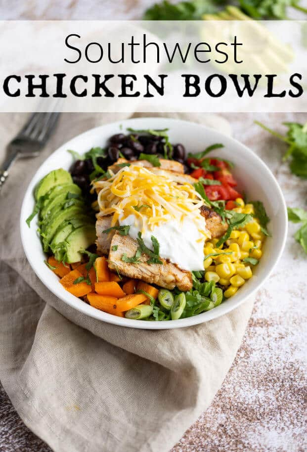 Grilled chicken, corn, tomatoes, black beans, avocado, bell peppers, and onion, in a white bowl. Chicken is topped with sour cream, cheese and cilantro. via @artfrommytable