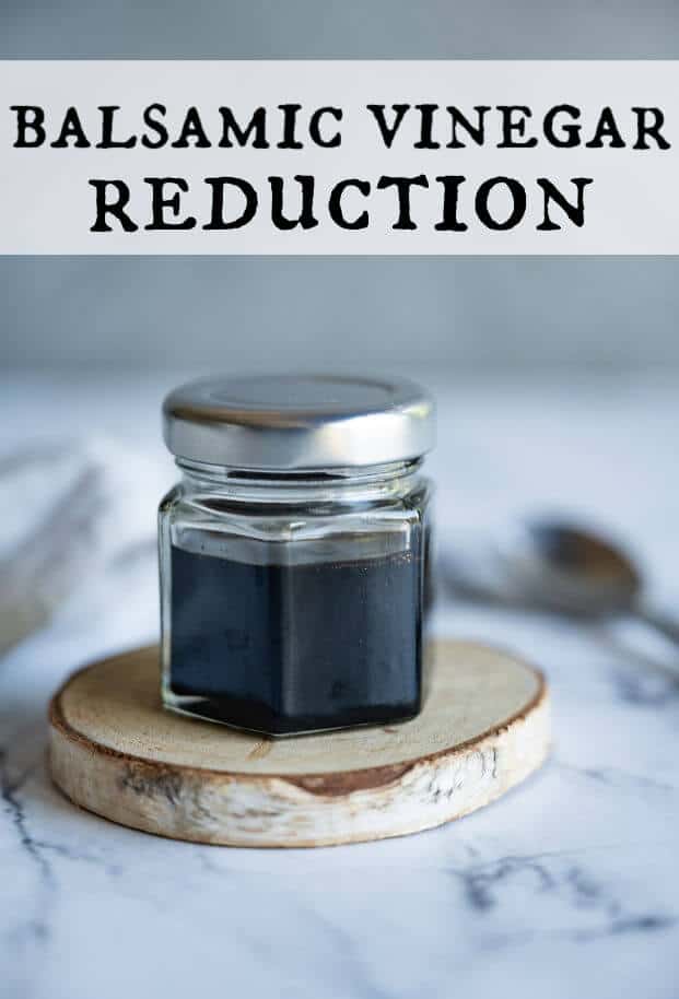 Balsamic reduction in a glass jar with a lid, spoon in the background. via @artfrommytable