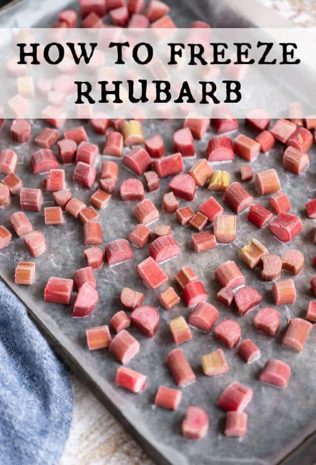 Pieces of frozen rhubarb on a wax paper lined rimmed baking sheet. via @artfrommytable