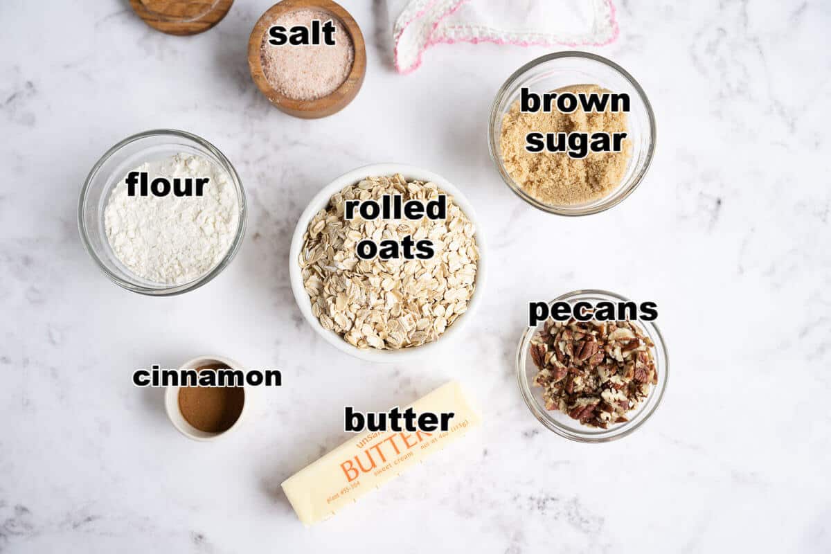 Ingredients to make the "crisp" topping: oats, brown sugar, flour, butter, cinnamon, pecans, and salt.
