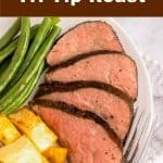 Sliced Tri-tip on a plate with green beans and potatoes.