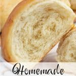 Homemade crescent roll split open to reveal its tender, fluffy inside, surrounded by more rolls in the background. Text overlay reads “Homemade Crescent Rolls.”