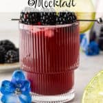 Blackberry mocktail in a ribbed glass with crushed ice, blackberries, and a lime slice. Blue flowers in the foreground and background, text overlay reads 'Blackberry Mocktail'.