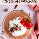 Top view of Cottage cheese chocolate mousse in a dessert glass topped with whipped cream, chocolate shavings, and garnished with a sliced strawberry. Text overlay reads: Cottage cheese Chocolate Mousse.