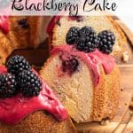 Partially sliced lemon blackberry bundt cake on a wooden board, showing the inside crumb and blackberry pockets. A stack of plates in the background. Text overlay reads: Lemon Blackberry Cake.